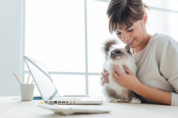 istock Woman cuddling her cat 513743680