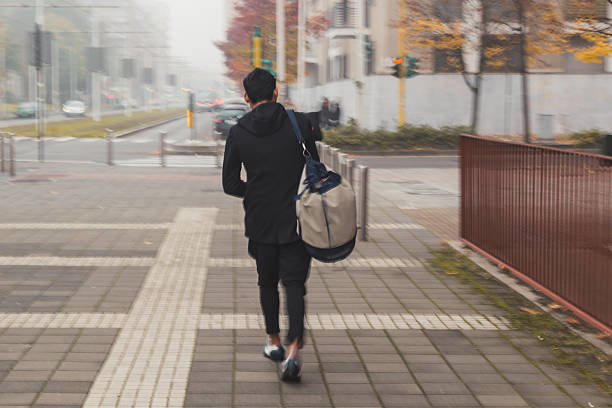 istock Stylish man walking in the street (intentionally blurred) 513749176