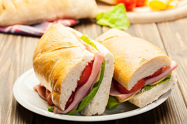 istock Italian panini sandwich with ham, cheese and tomato 513749746
