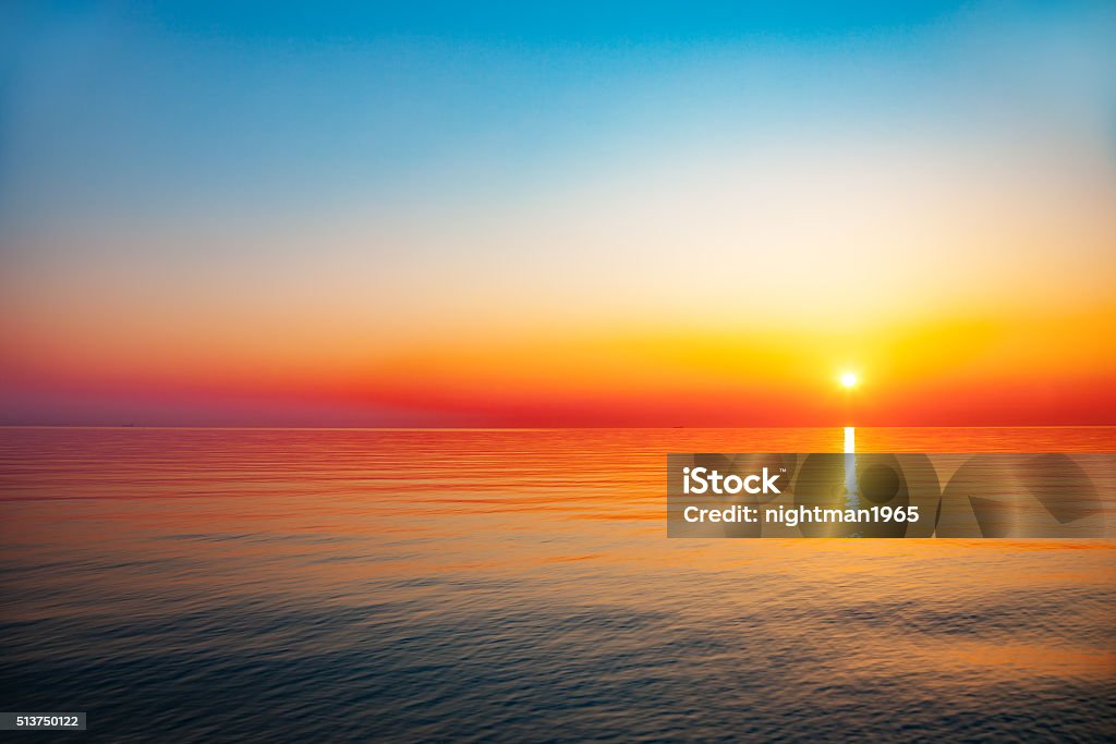Sunrise at sea Baltic sea - early morning sunrise over the sea. Sunrise - Dawn Stock Photo