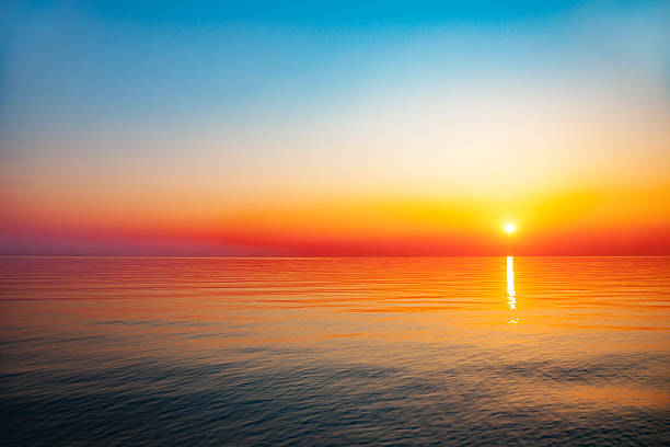 Sunrise at sea stock photo