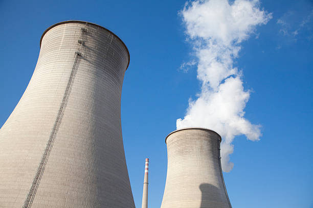 istock Smoke stacks at power plant 513750749