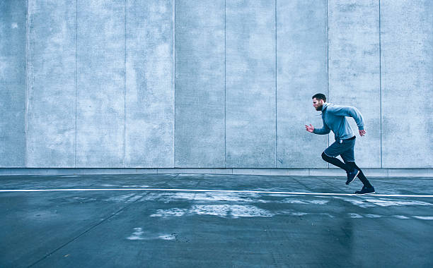 istock Runner sets of with fast pace and goes for run 513751940