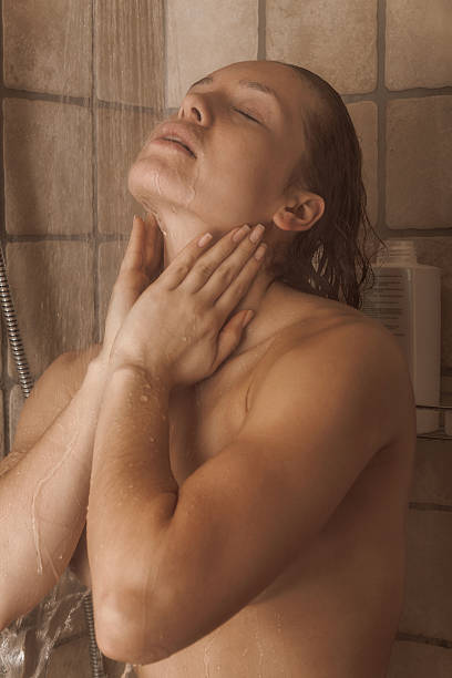istock Beautiful young woman taking shower 513751944