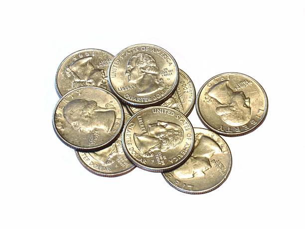 istock US quarter dollar coins on white photo. 513752847