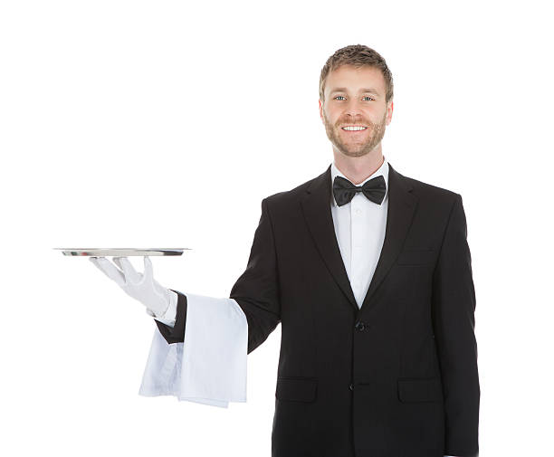 istock Smiling Young Waiter Holding Empty Serving Tray 513753263
