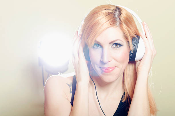 istock Ginger Girl with headphones 513753519