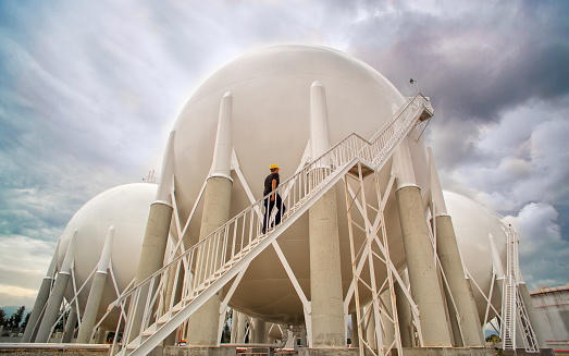 Petroleum Storage Tanks and a worker