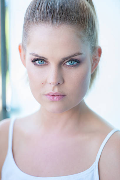 istock Blue eyed young woman staring intently 513753625