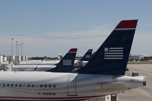 Charlotte, NC - May 2, 2014: US Airways aircraft at terminal C during evening rush hour