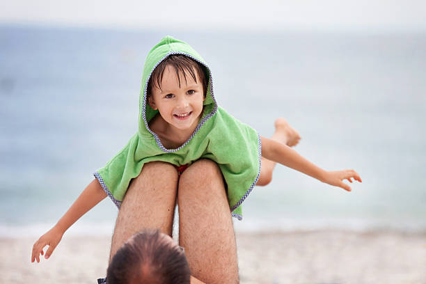 istock Beautiful boy, making airplane with hands, dad holding him 513754606