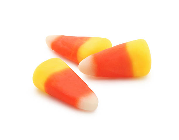 Candy Corn Candy Corn isolated on white candy corn stock pictures, royalty-free photos & images