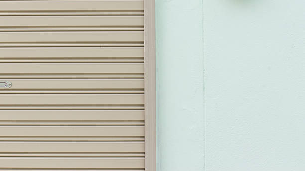 istock Building made of concrete with roller shutter door 513754855