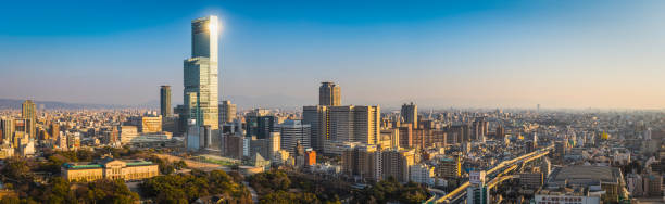 istock Sunlight glinting from skyscraper overlooking city Abeno Harukas Osaka Japan 513755056