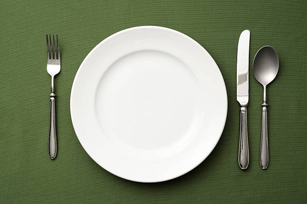 istock Overhead shot of place setting on green tablecloth 513755237