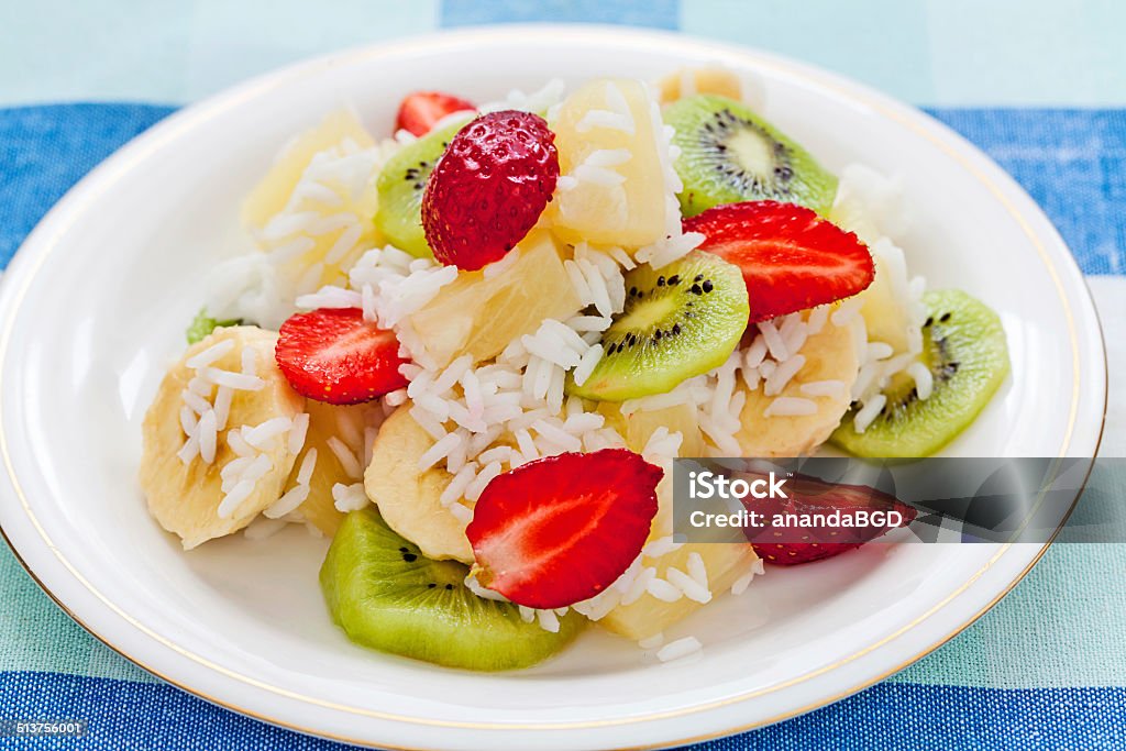 fruit salad fruit salad with rice on the plate Banana Stock Photo