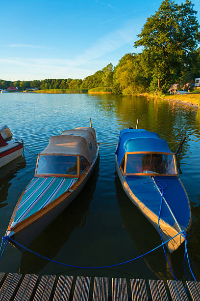 istock romantic light with canoe boats - lake in sunset 513756392