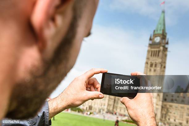 Tourist Taking A Picture Of The Ottawa Parliament Canada Stock Photo - Download Image Now