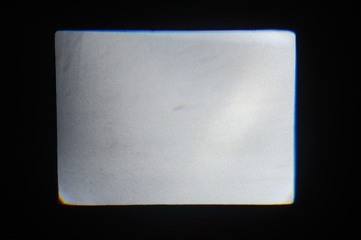 The rectangle of light on a black background coming from the overhead projector