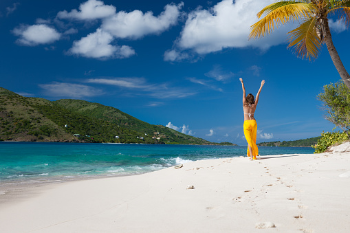 woman walking on a deserted island in the Caribbean, Sandy Cay, British Virgin Islands