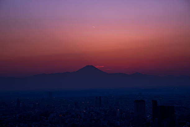 istock Mt. Fuji silhouette at dusk from Tokyo bay area 513759108