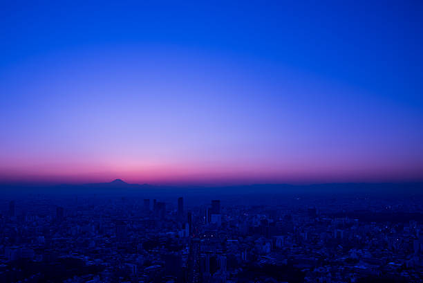 istock Mt. Fuji silhouette at dusk from Tokyo bay area 513759516