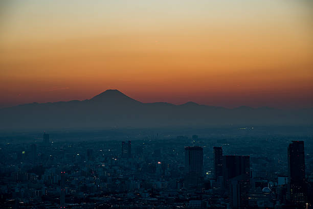 istock Mt. Fuji silhouette at dusk from Tokyo bay area 513759678
