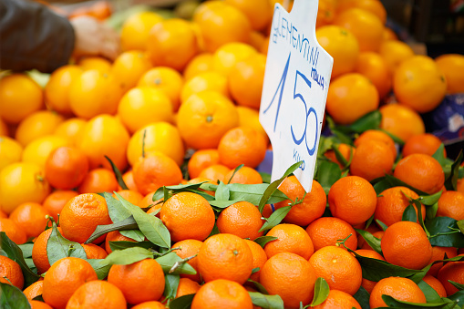 Fresh oranges and clementines at farmer market in Italy.