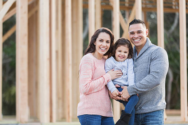 istock Hispanic family building a new home 513761582