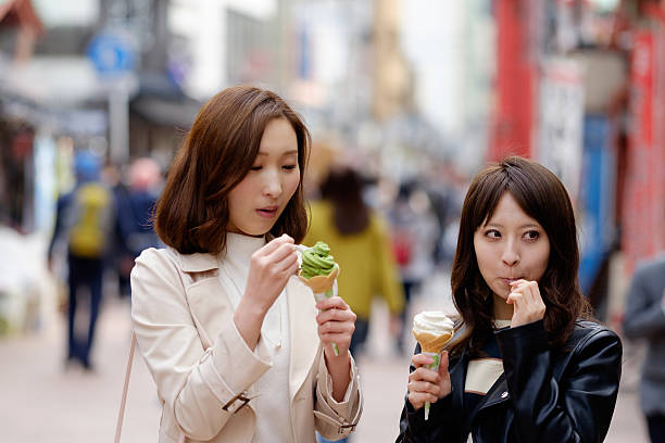 istock Women eating Ice cream on vacation travel 513763232