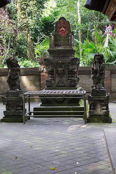 istock Ancient stone sculpture in the Balinese jungle 513763408