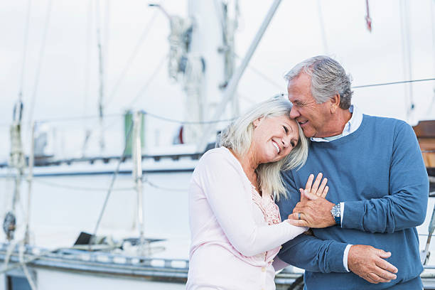 Affectionate mature couple at marina