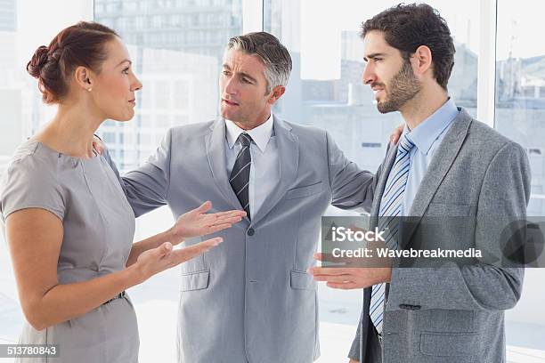 Businesswoman Arguing With Coworker Stock Photo - Download Image Now - Discussion, Front View, Business