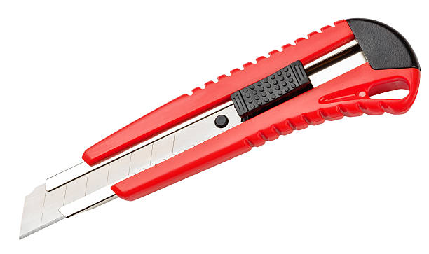 istock Red paper knife isolated on white background 513781049