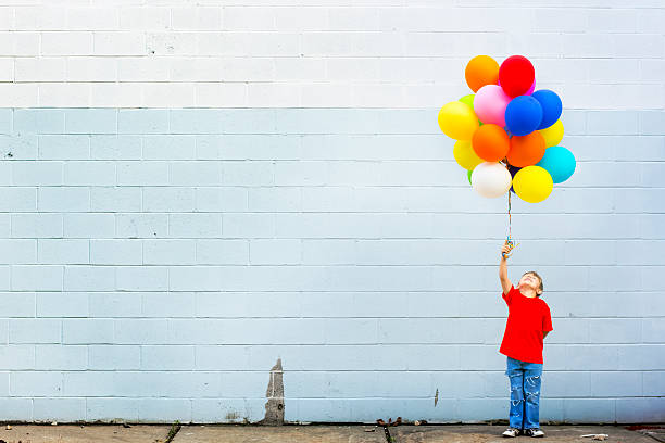 ballons - child balloon happiness cheerful stock-fotos und bilder