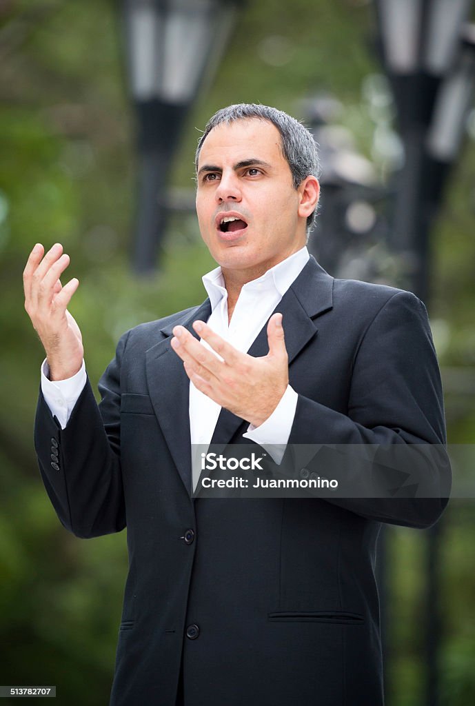 Mature Tenor Mature tenor posing singing at the park Opera Singer Stock Photo