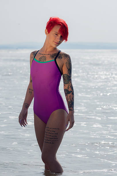 istock Redhaired Woman Knee-deep In The Sea 513782823