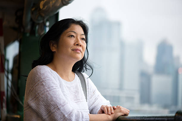 Mature Asian Woman Riding Ferry