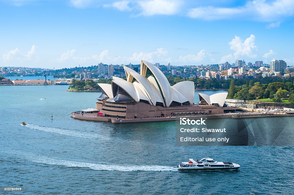 Sydney Opera House Sydney, Australia - March 30, 2014: Sydney Opera House view on march 30,2014 in Sydney, Australia. The Sydney Opera House is a famous arts center. It was designed by Danish architect Jorn Utzon, finally opening in 1973 Sydney Opera House Stock Photo