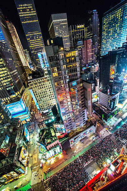 Crowds celebrating New Year on Times Square, NYC Crowds celebrating New Year on Times Square, NYC new years eve new york stock pictures, royalty-free photos & images