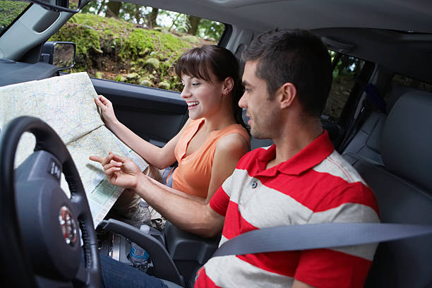 istock Couple With Map In Car 513786939