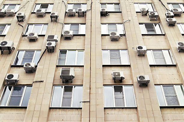 istock mani air conditioners on the building wall 513787621