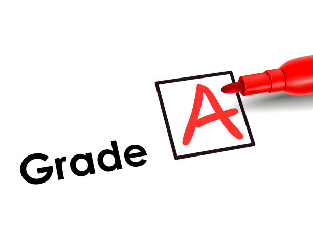 close-up look of A grade close-up look of A grade over exam paper report card stock pictures, royalty-free photos & images