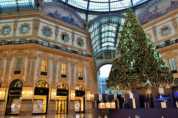 Milan,Italy-January 1, 2016. A view to the Christmas tree by Swarovski and the Vittorio Emanuele II decorated Gallery. 