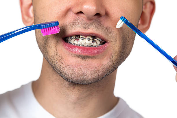 istock Young man with two brush, half of head 513791532