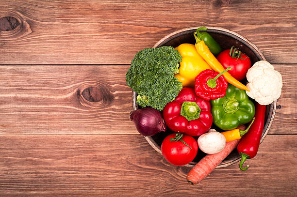 istock Fresh vegetables on the wooden tray on the rustic background. 513792258