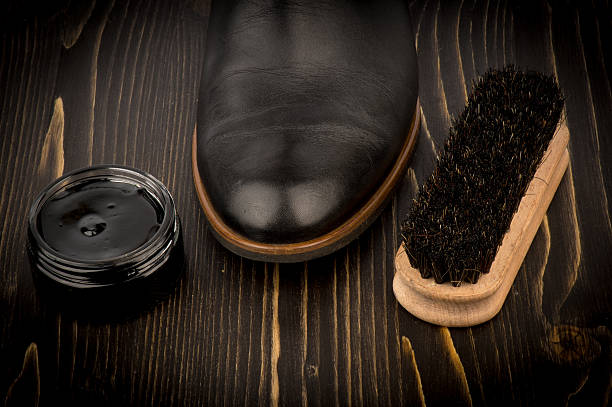 Shoe wax and brush on the wooden background. Shoe wax and brush on the wooden background. shoe polish stock pictures, royalty-free photos & images