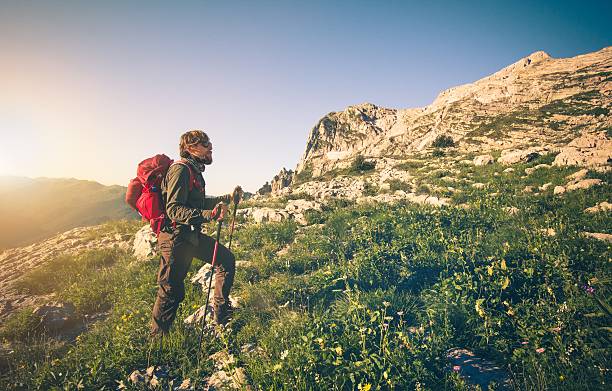istock Young Man with backpack mountaineering outdoor 513794672