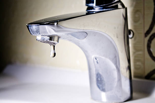 istock Modern faucet with water drop 513794962