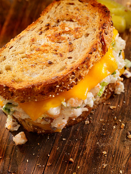 Grilled Cheese Seafood Salad Sandwich Grilled Cheese Seafood Salad Sandwich with Shrimp and Lobster-Photographed on Hasselblad H3D2-39mb Camera melting tuna cheese toast stock pictures, royalty-free photos & images